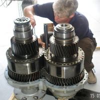 A ZF marine gearbox stripped down on the bench, gear clusters lifted clear of the casing.